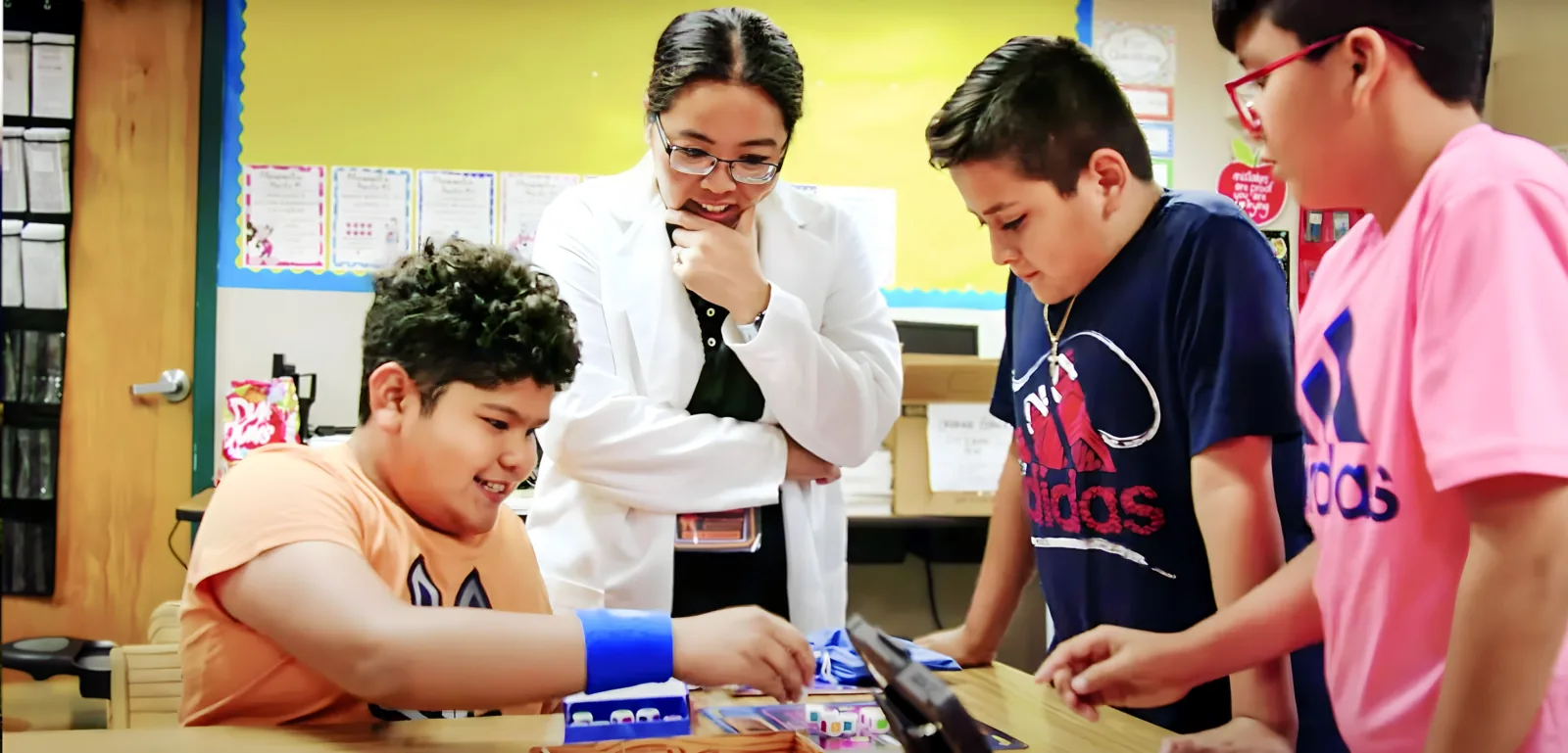 A facilitator observing students at work