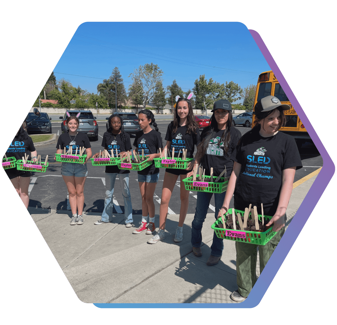 SLED students with their seedlings at their community garden event