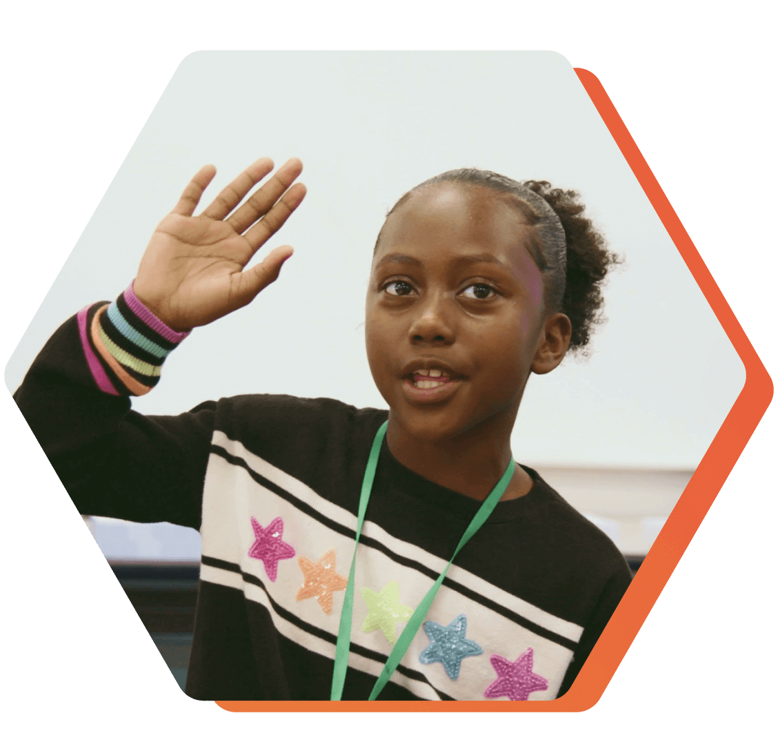 QUEST Student raising her hand during a lesson