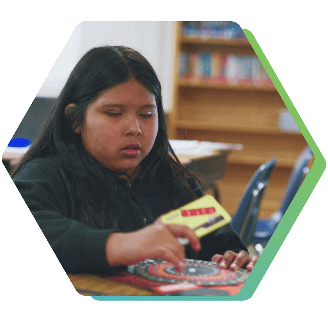 QUEST Visalia student focusing on a challenge puzzle