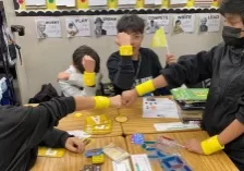 Four QUEST Students on the yellow team showing off their team swag