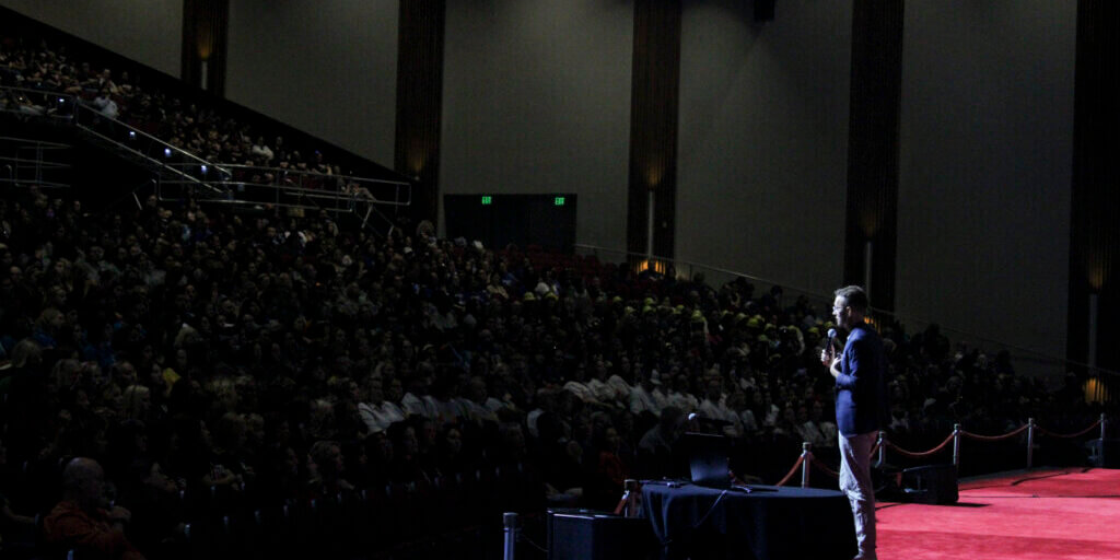 Travis Allen, ProSolve CEO, gives a keynote presentation to a crowd of educators.