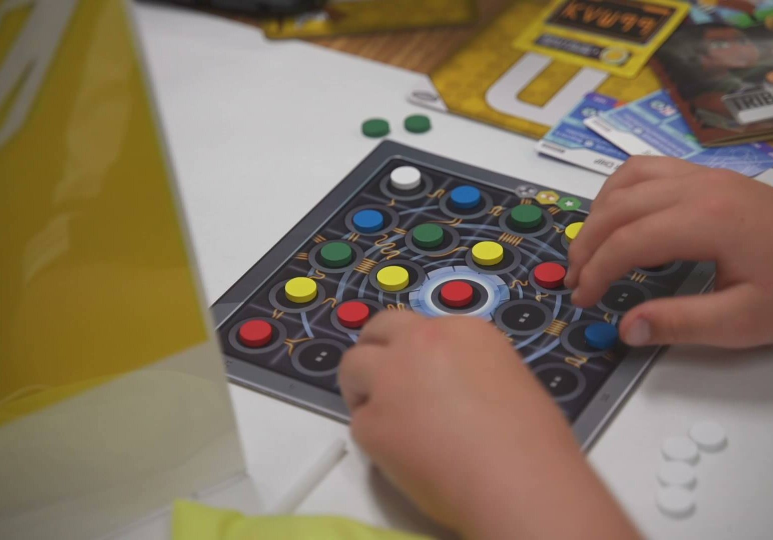 Close up of student's hands playing a QUEST challenge game