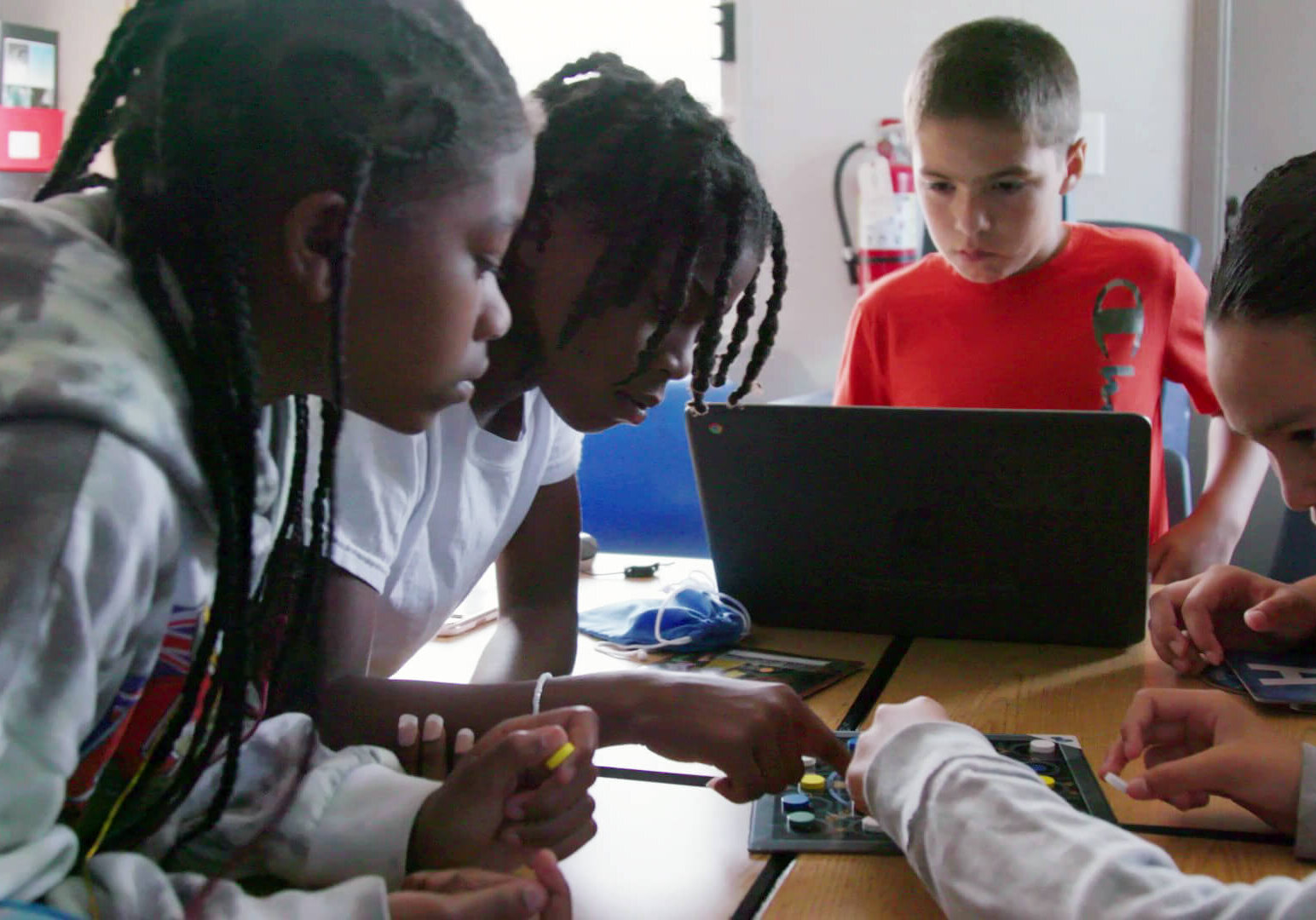 Four students playing a QUEST challenge game at Stockton USD