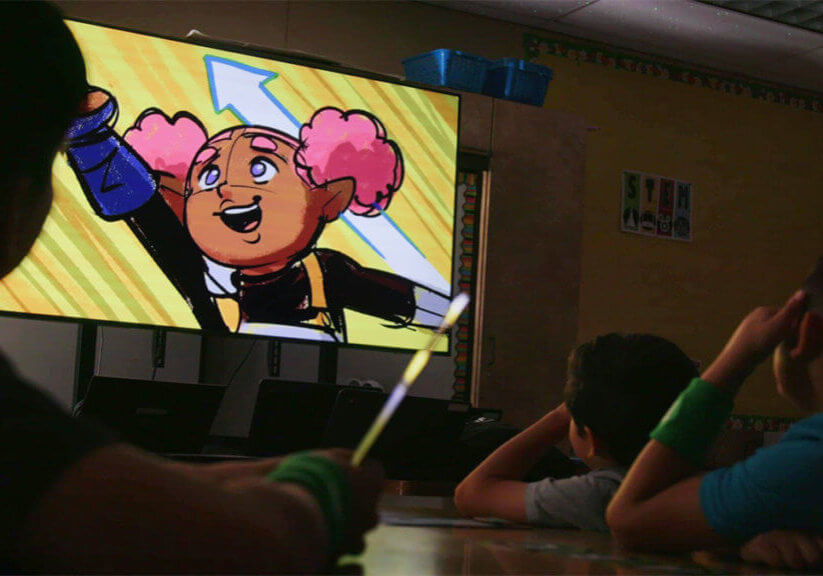 Starforce students watching a video on a projector screen